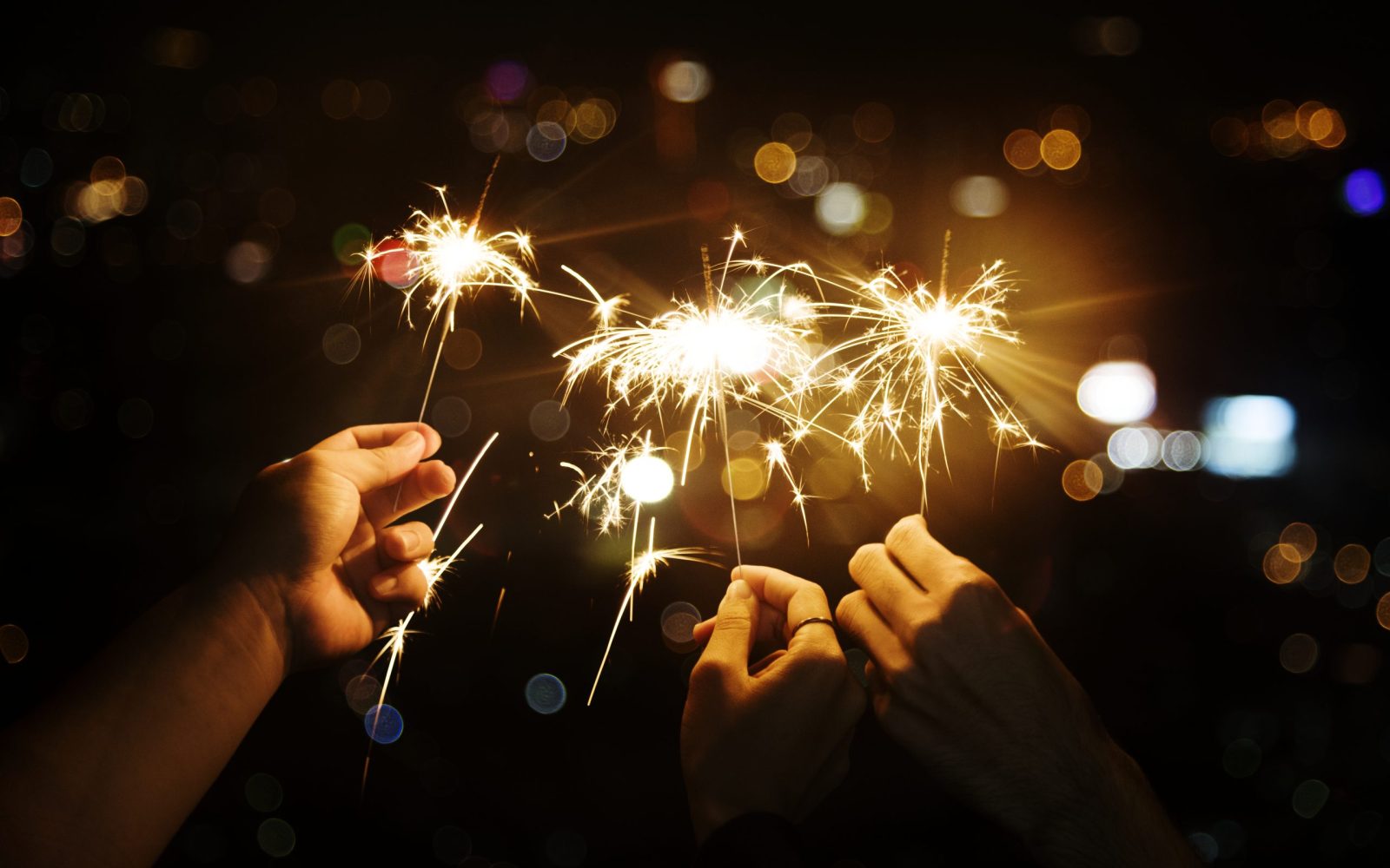 Celebrating with sparklers in the night Celebrating with sparklers in the night
